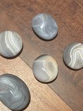 Banded agate palm stones